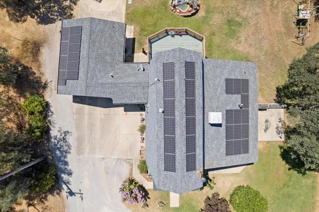 a view of a yard with trees