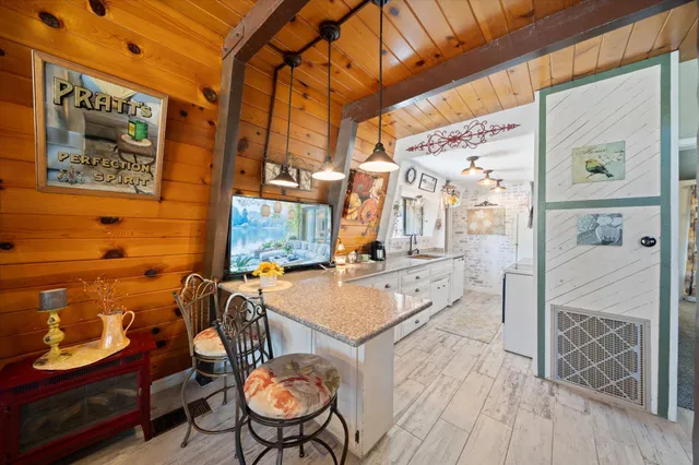 a bed room with a bed and a chair