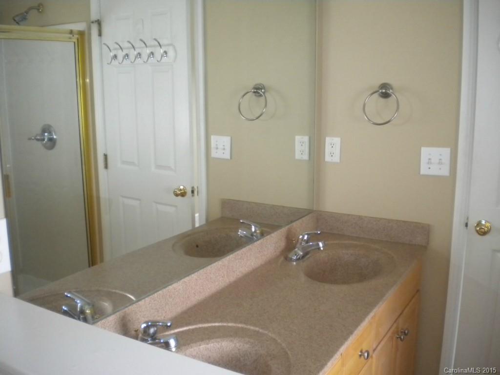 2309 Hargett Road Matthews, NC 28105 - Photo 19 of 24 a bathroom with a sink and shower