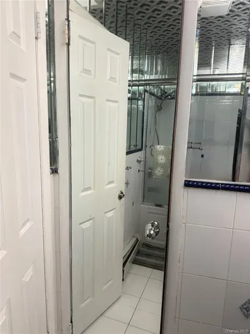 a bathroom with a shower and a sink