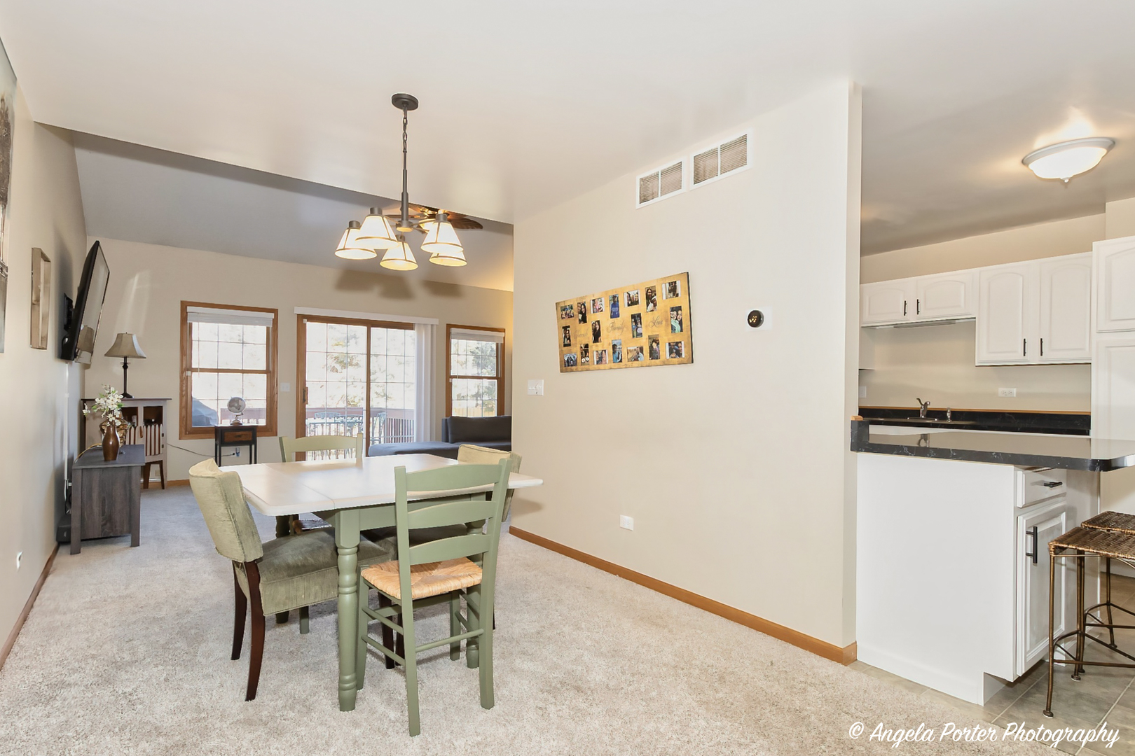 5850 Fieldstone Trail McHenry, IL 60050 - Photo 11 of 28 a view of a dining room with furniture window and wooden floor