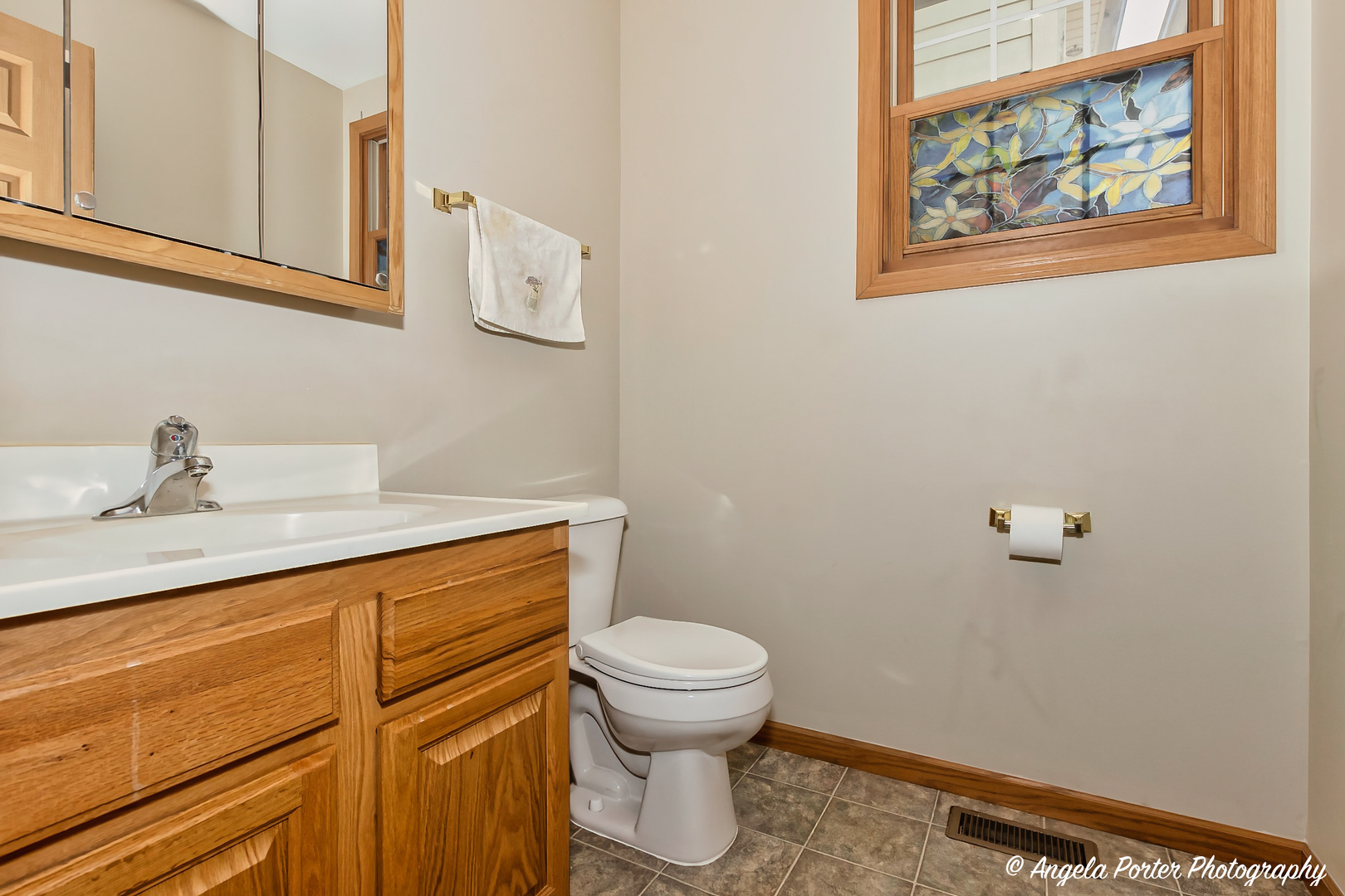 5850 Fieldstone Trail McHenry, IL 60050 - Photo 13 of 28 a bathroom with a sink a toilet and a mirror