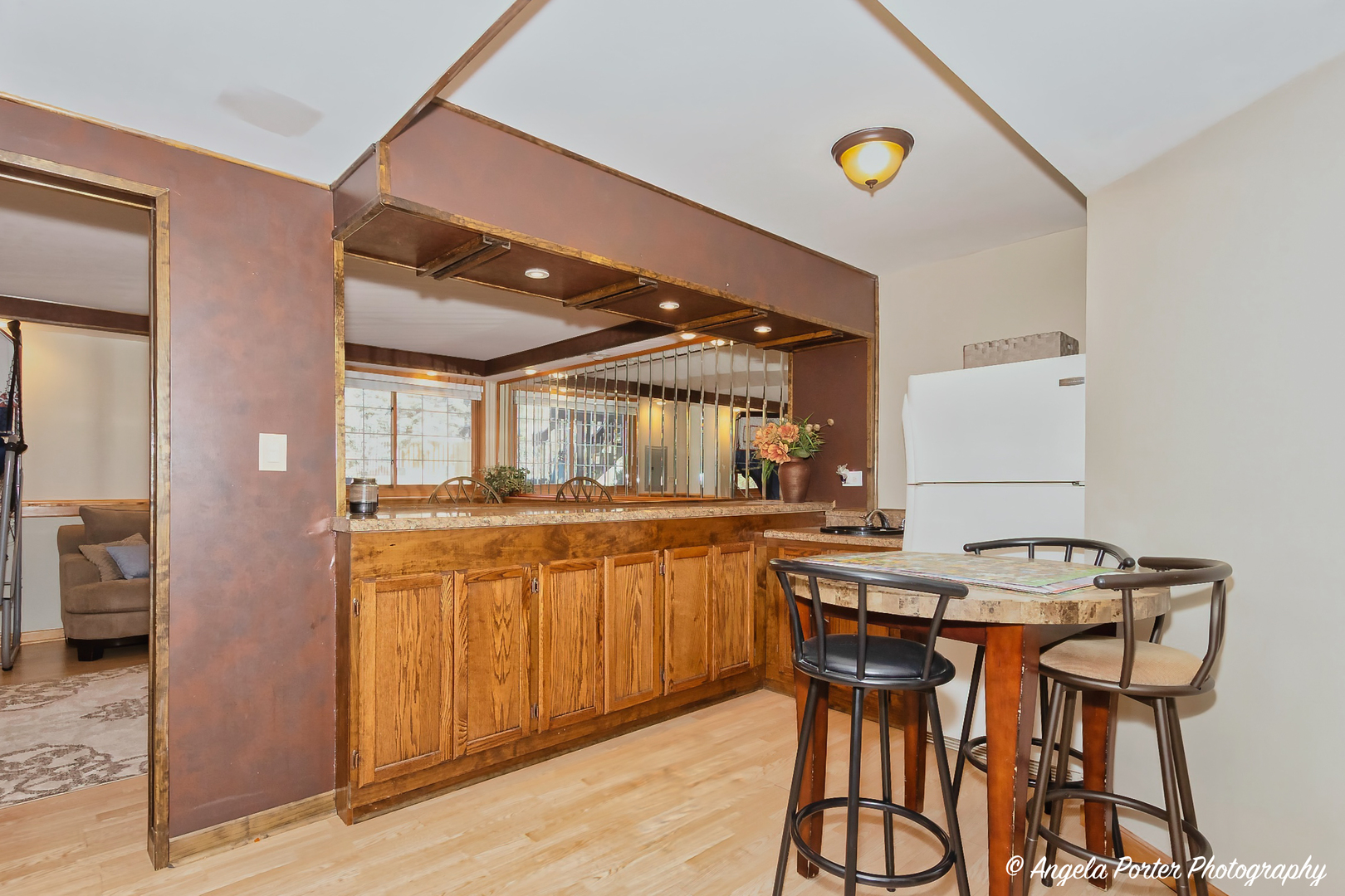 5850 Fieldstone Trail McHenry, IL 60050 - Photo 24 of 28 a dining hall with stainless steel appliances kitchen island granite countertop a table and chairs