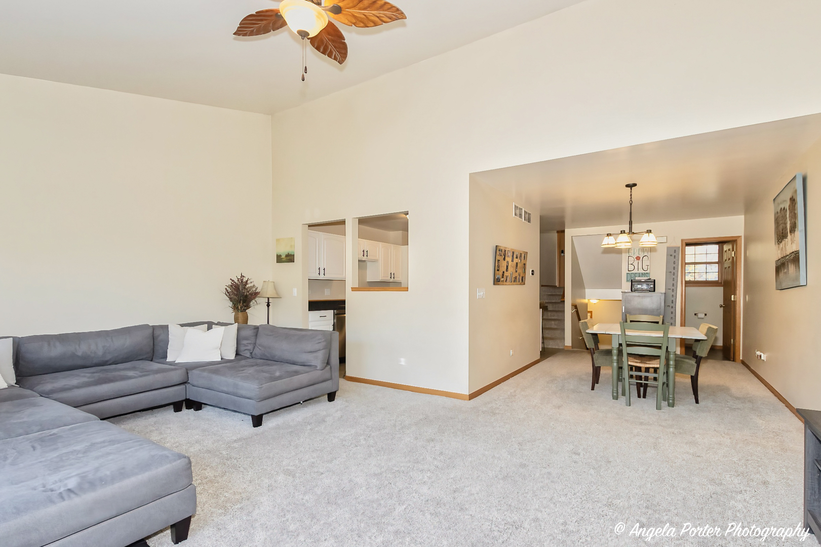 5850 Fieldstone Trail McHenry, IL 60050 - Photo 3 of 28 a living room with furniture and a chandelier