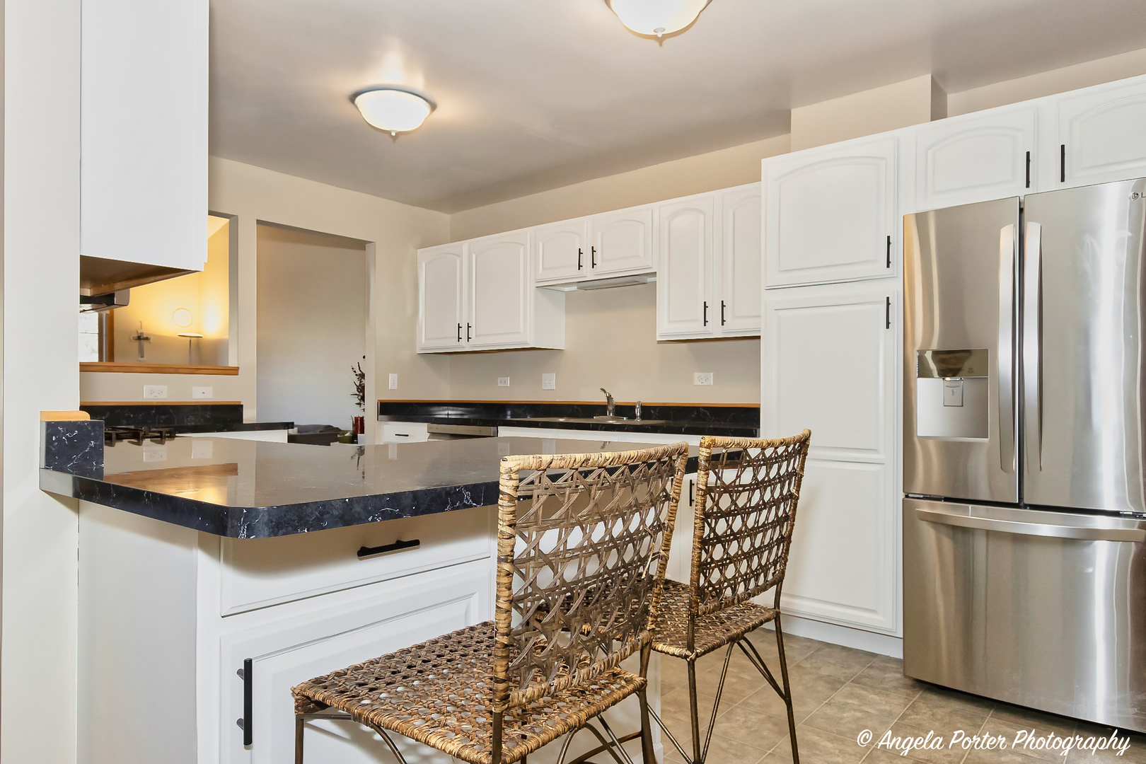 5850 Fieldstone Trail McHenry, IL 60050 - Photo 9 of 28 a kitchen with granite countertop a refrigerator a stove a sink and white cabinets