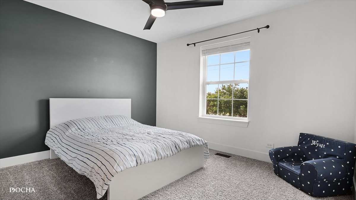 26827 Ashgate Crossing Plainfield, IL 60585 - Photo 18 of 31 a bedroom with a bed dresser and a window