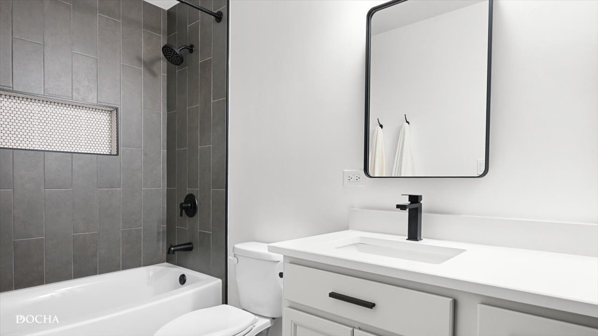 26827 Ashgate Crossing Plainfield, IL 60585 - Photo 20 of 31 a bathroom with a sink a toilet and vanity