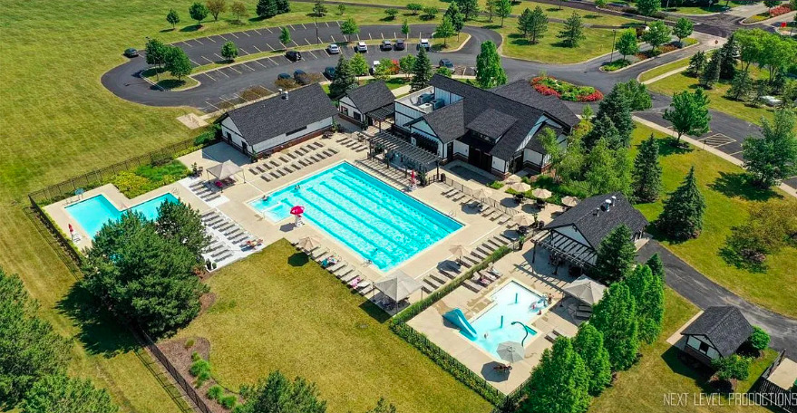 26827 Ashgate Crossing Plainfield, IL 60585 - Photo 30 of 31 an aerial view of a house with a lake view