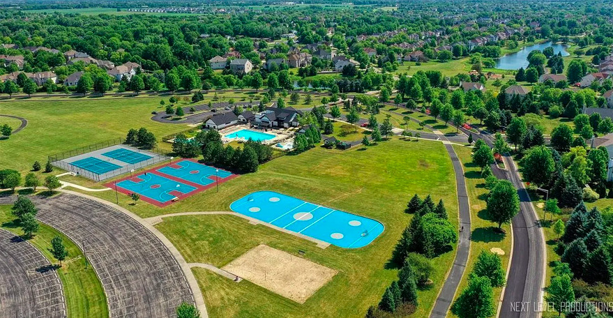 26827 Ashgate Crossing Plainfield, IL 60585 - Photo 31 of 31 an aerial view of a house with a swimming pool yard and outdoor seating