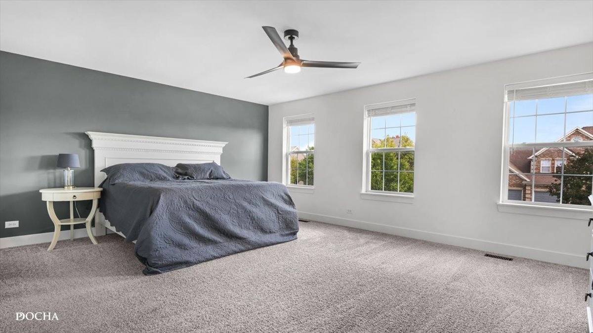 26827 Ashgate Crossing Plainfield, IL 60585 - Photo 9 of 31 a bedroom with a bed and window