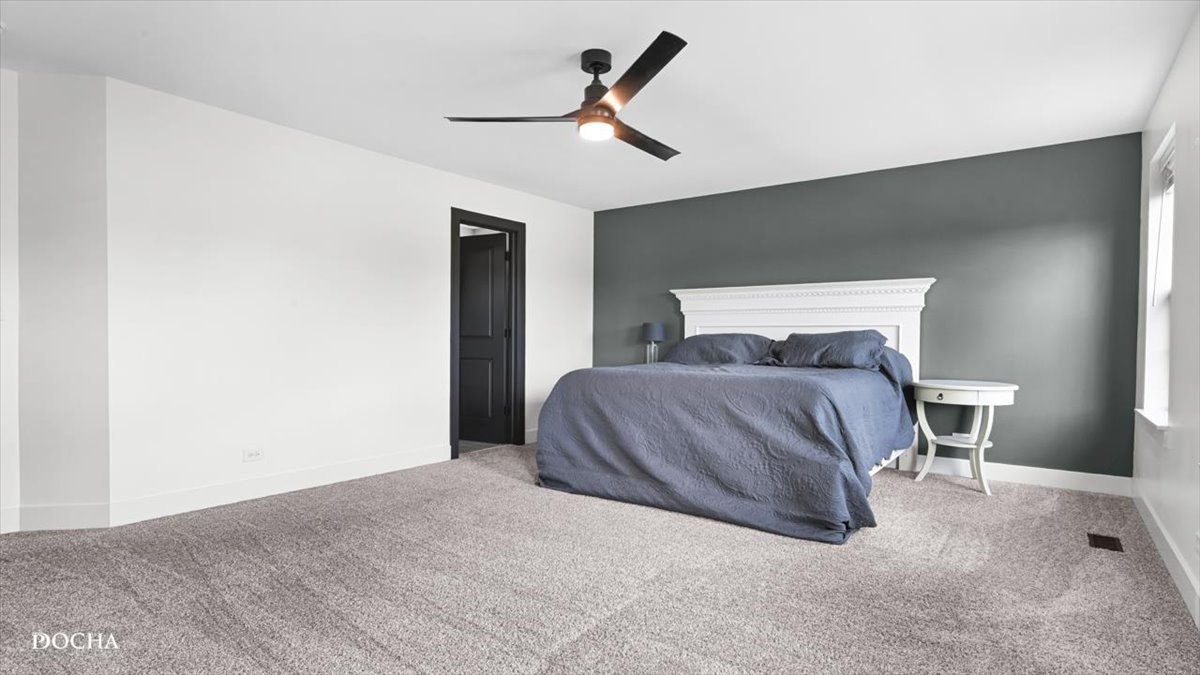 26827 Ashgate Crossing Plainfield, IL 60585 - Photo 10 of 31 a bedroom with a bed and a ceiling fan