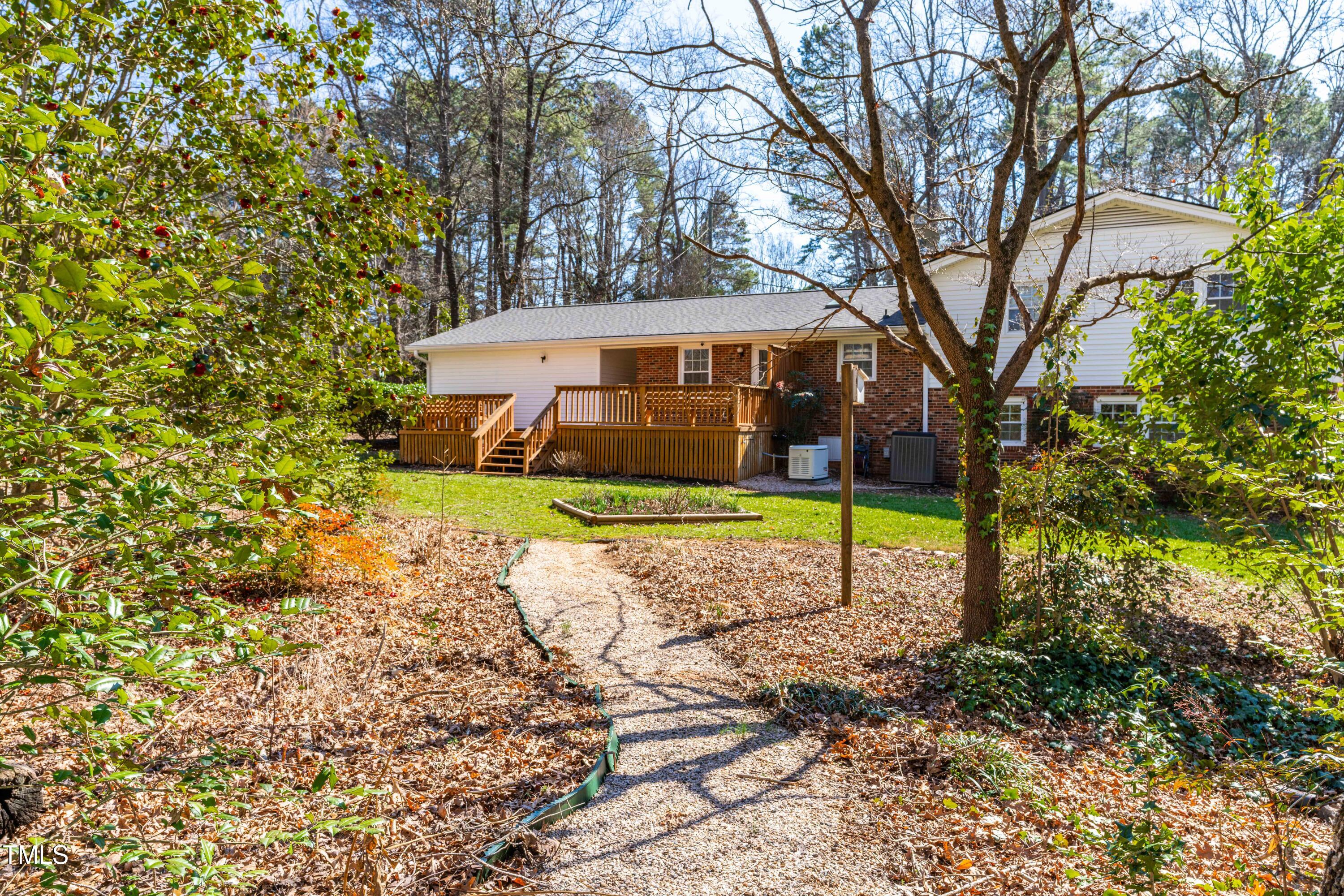 6500 Brandywine Road Raleigh, NC 27607 - Photo 31 of 41 a view of a house with a yard