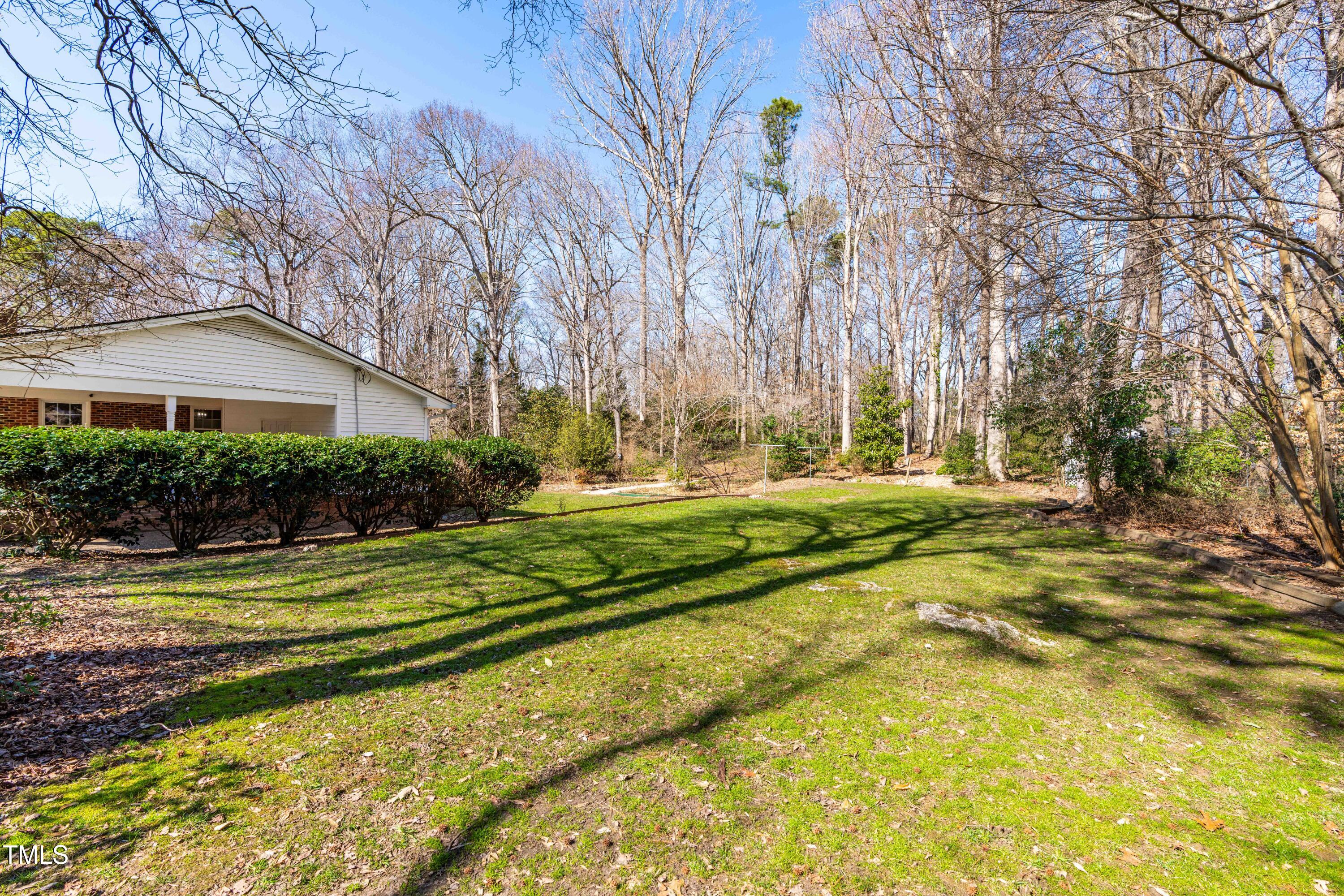 6500 Brandywine Road Raleigh, NC 27607 - Photo 34 of 41 a view of a house with large trees and a big yard