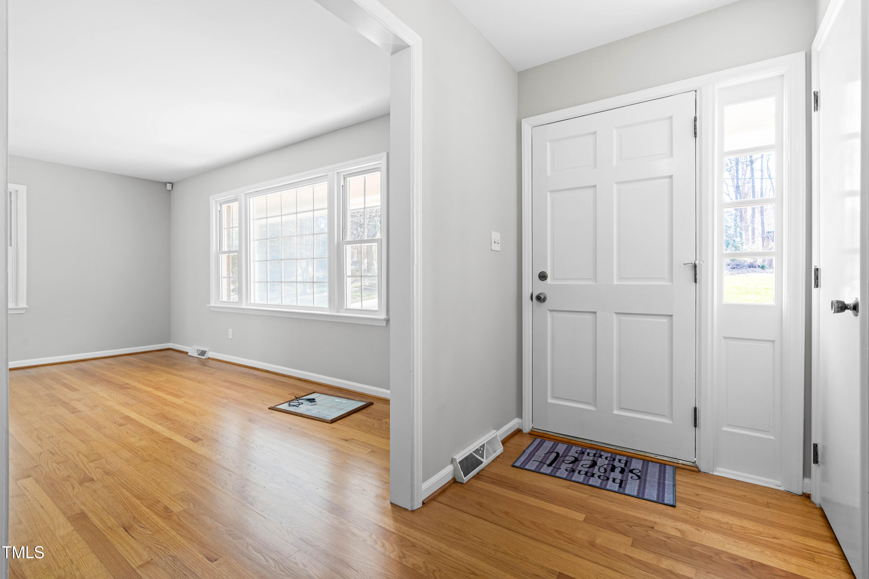 6500 Brandywine Road Raleigh, NC 27607 - Photo 4 of 41 a view of room with hardwood floor and window