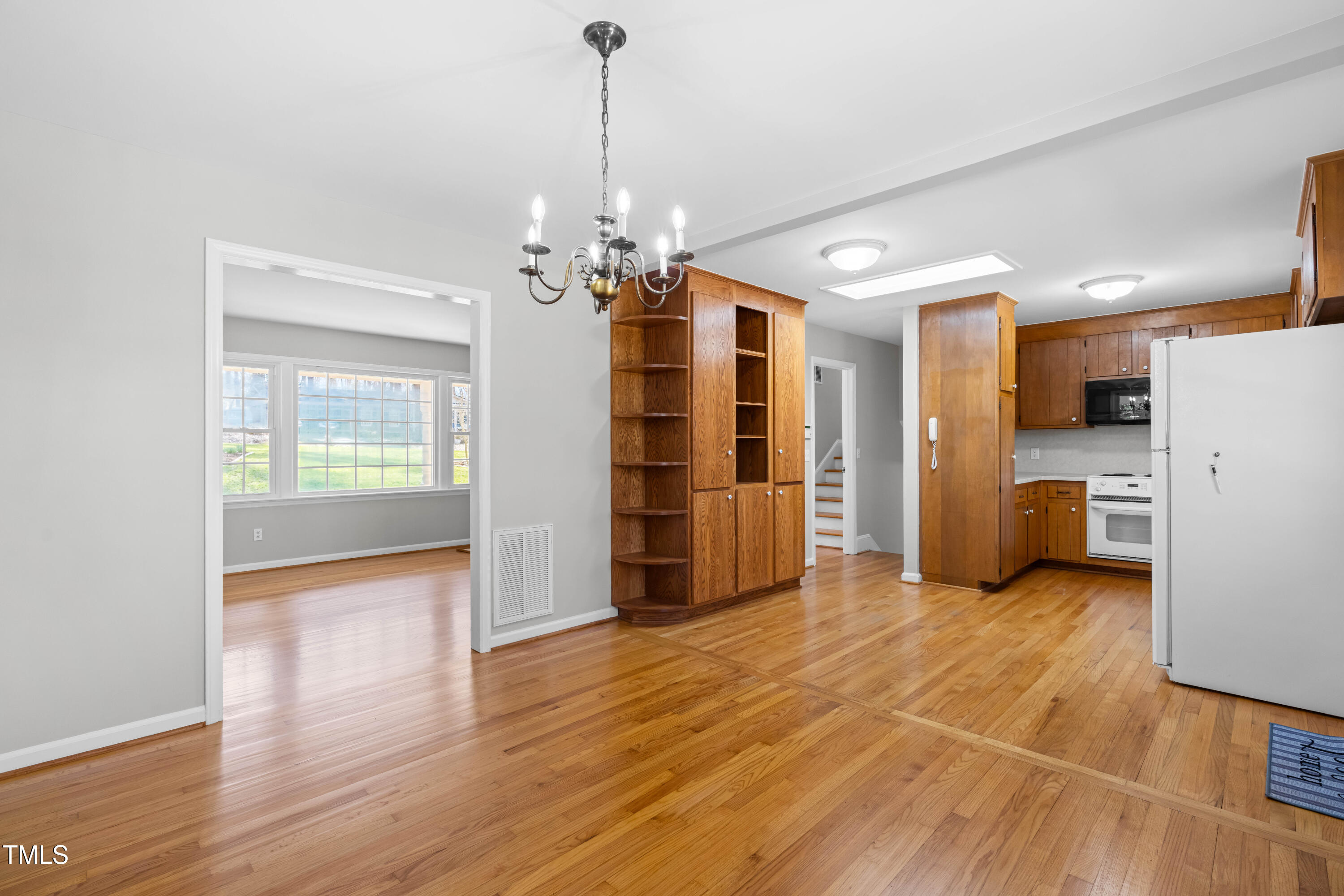6500 Brandywine Road Raleigh, NC 27607 - Photo 8 of 41 a view of a kitchen with a refrigerator a microwave and a sink