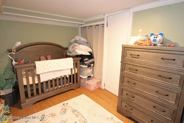 a view of a bedroom with furniture and staircase