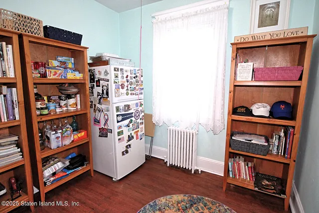 a living room with lots of furniture and a book shelf