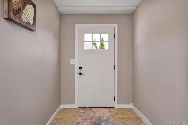 a view of living room with granite countertop furniture and fireplace