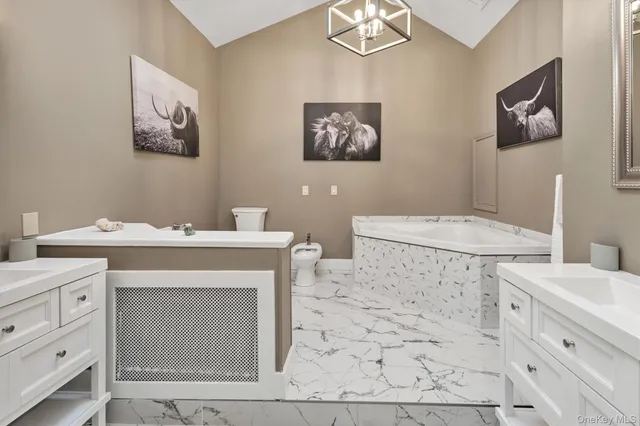 a bedroom with a bed and a flat tv screen