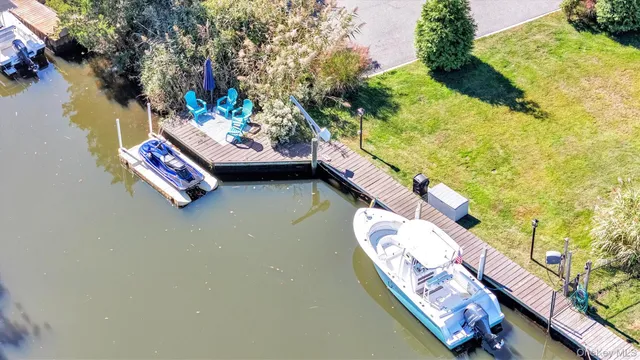an aerial view of a house with yard