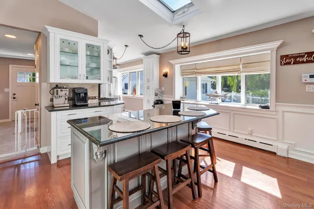a kitchen with granite countertop lots of counter top space and dining table