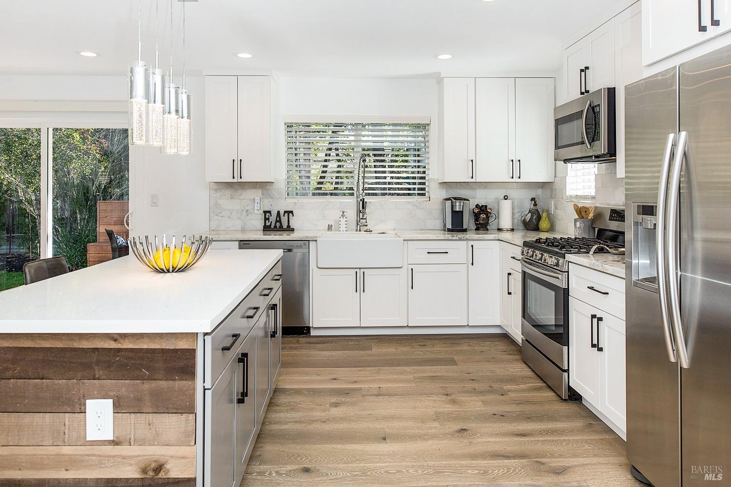3002 Foothill Boulevard Calistoga, CA 94515 - Photo 13 of 60 a kitchen with a sink a counter top space stainless steel appliances and cabinets