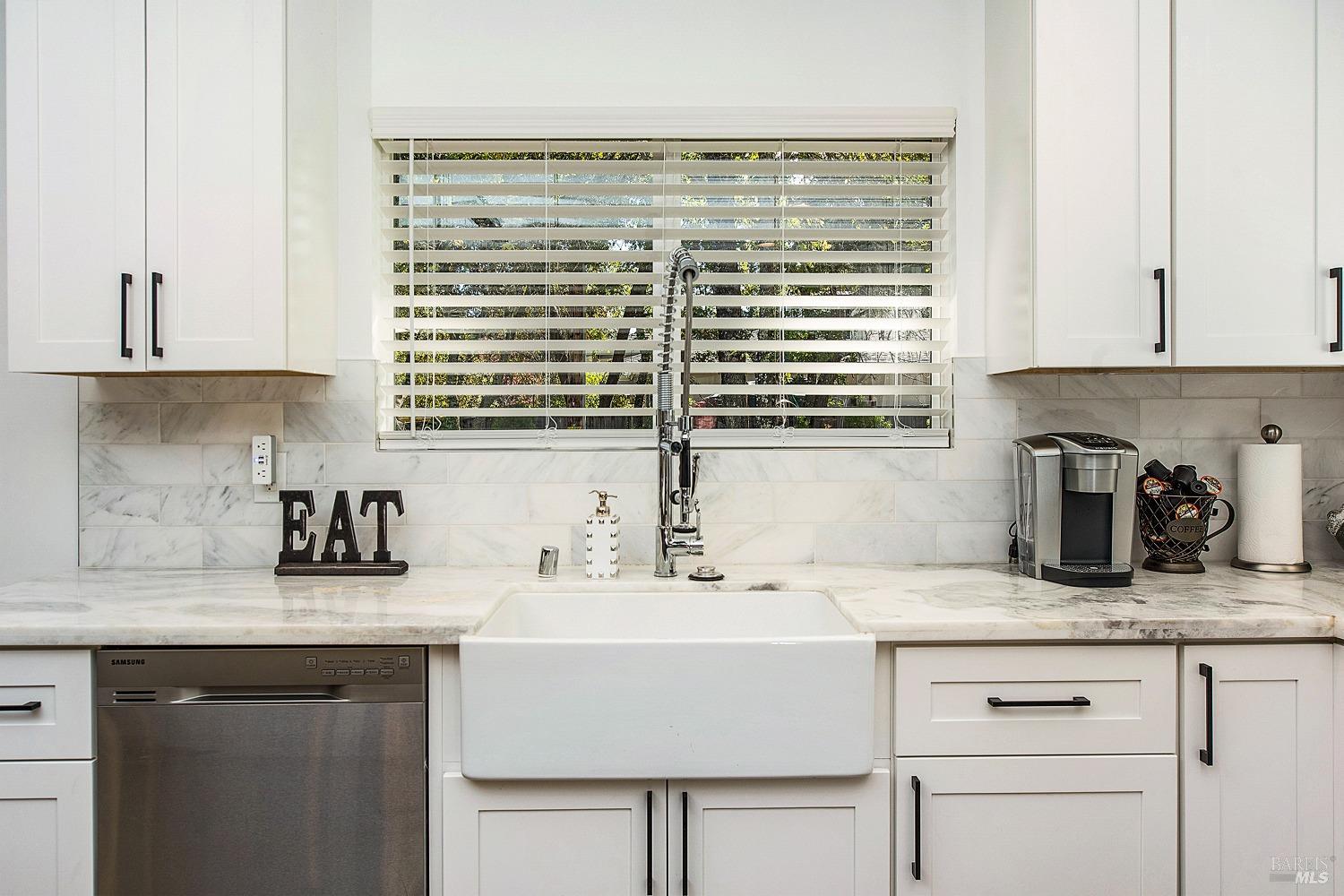 3002 Foothill Boulevard Calistoga, CA 94515 - Photo 14 of 60 a kitchen with granite countertop a sink and a window