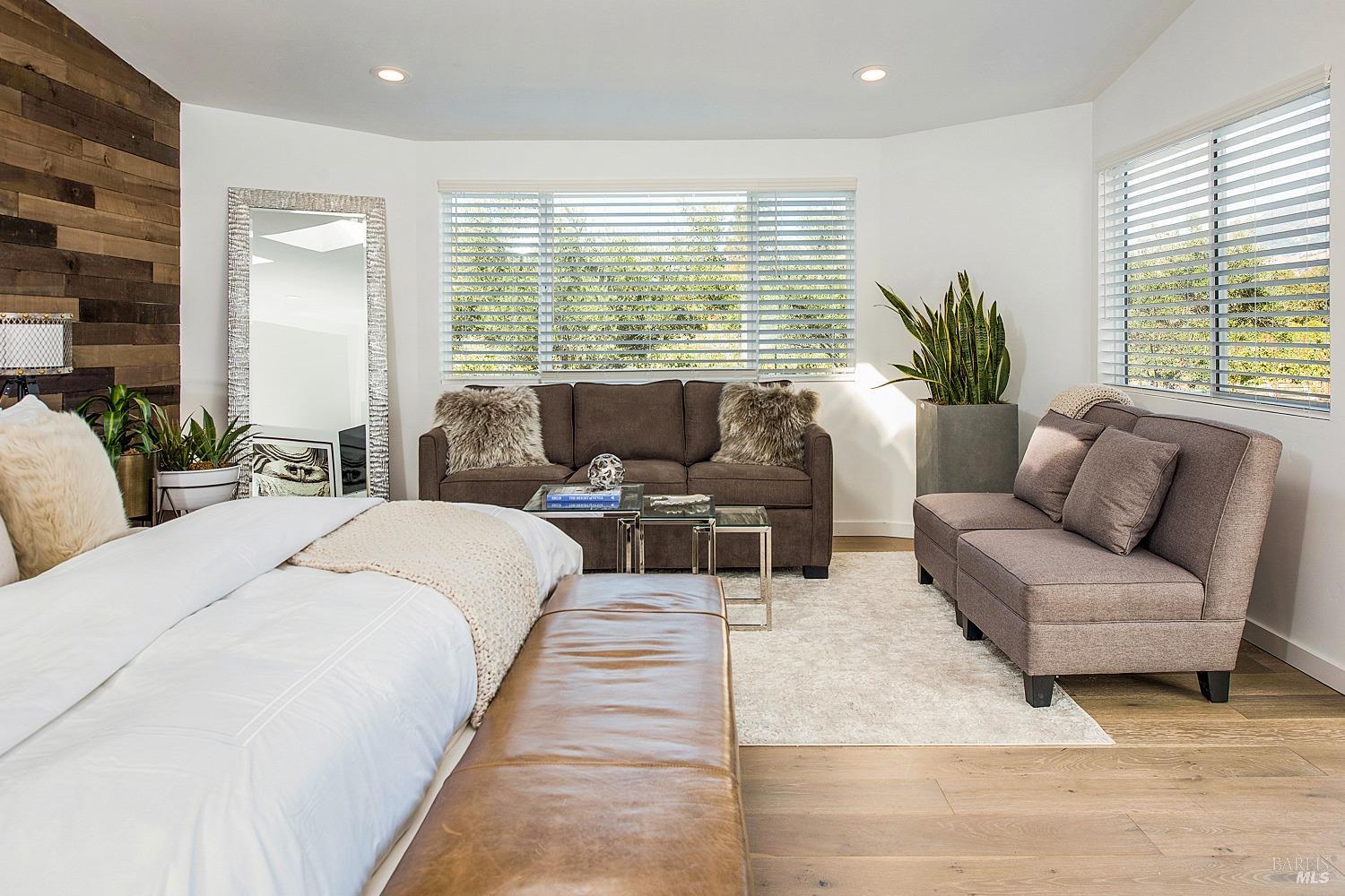 3002 Foothill Boulevard Calistoga, CA 94515 - Photo 24 of 60 a spacious bedroom with a large bed and a couch
