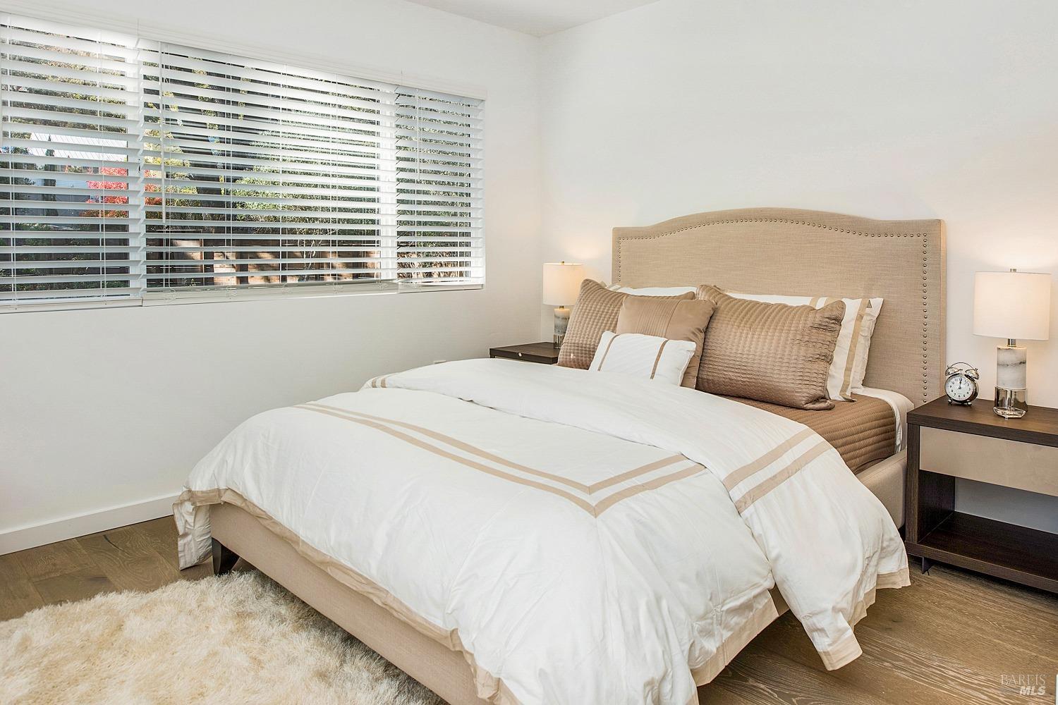 3002 Foothill Boulevard Calistoga, CA 94515 - Photo 29 of 60 a large bed sitting in a bedroom next to a window