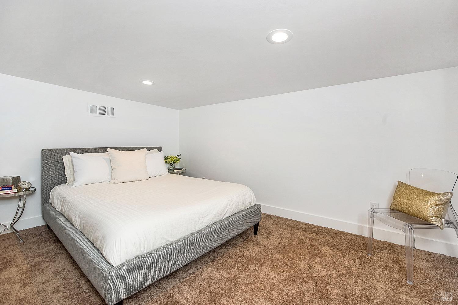 3002 Foothill Boulevard Calistoga, CA 94515 - Photo 41 of 60 a bedroom with a bed and chair