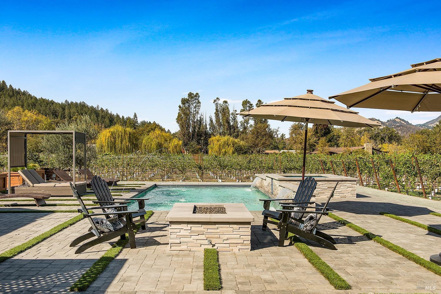 3002 Foothill Boulevard Calistoga, CA 94515 - Photo 53 of 60 a view of a patio with table and chairs under an umbrella
