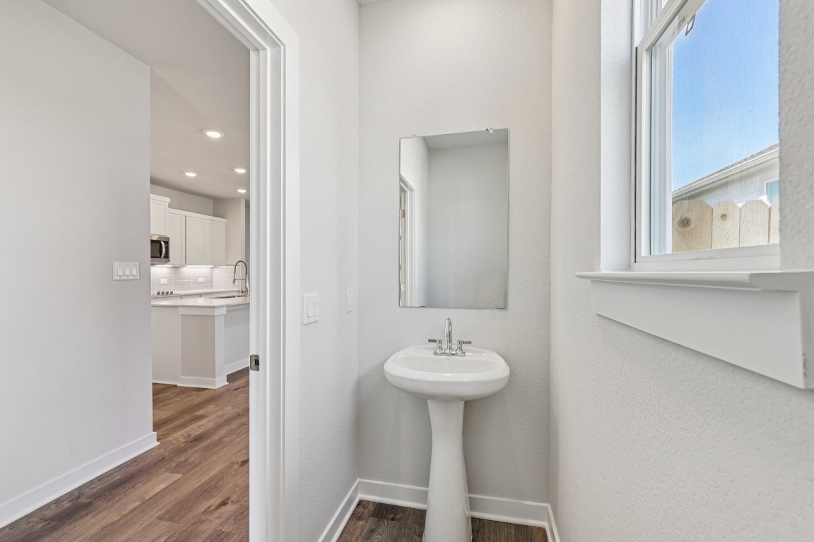 1212 Lavender Way Georgetown, TX 78628 - Photo 13 of 32 a bathroom with a sink toilet and a mirror