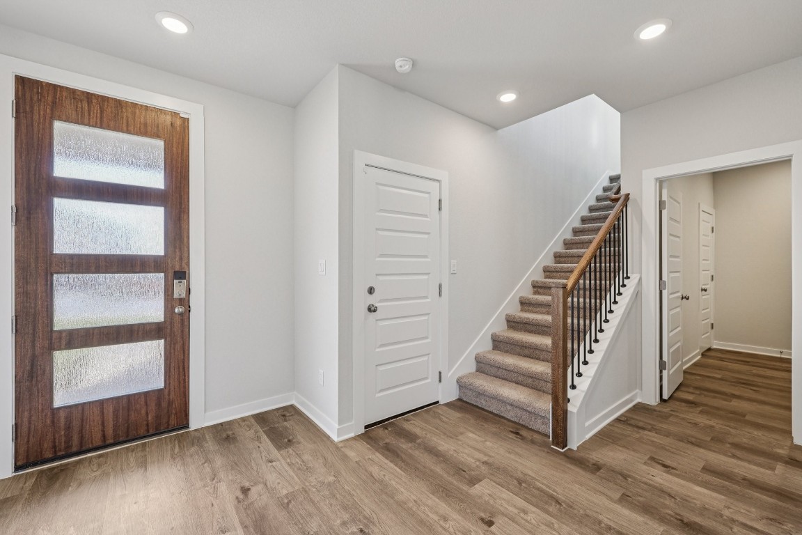 1212 Lavender Way Georgetown, TX 78628 - Photo 16 of 32 a view of an entryway with wooden floor