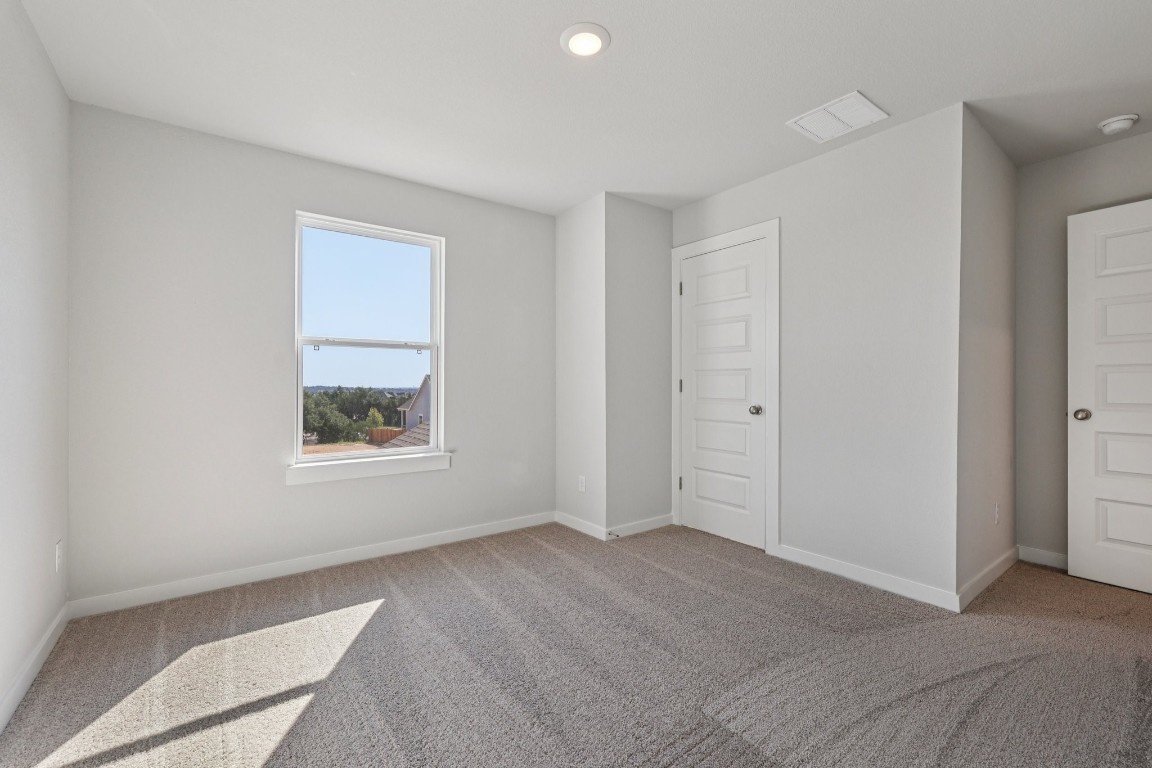 1212 Lavender Way Georgetown, TX 78628 - Photo 18 of 32 a view of an empty room with a window