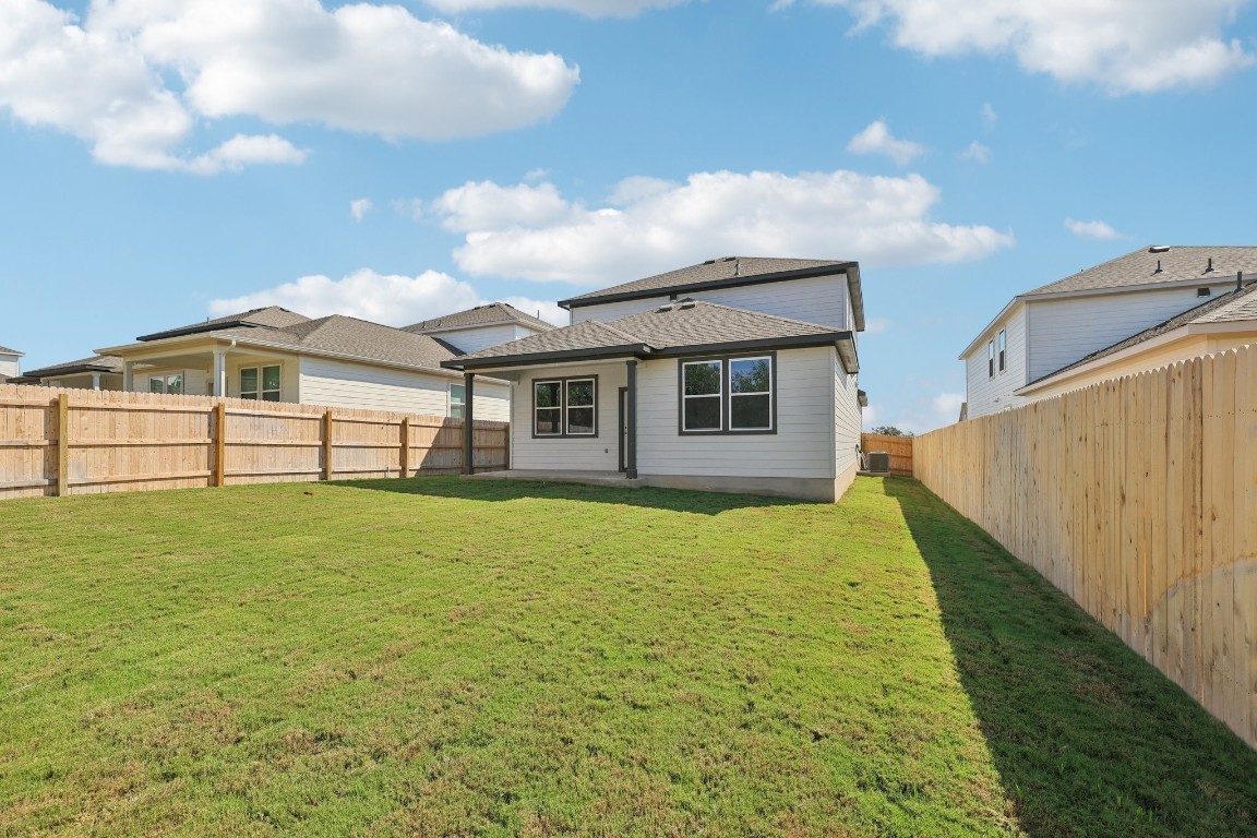 1212 Lavender Way Georgetown, TX 78628 - Photo 21 of 32 a view of a house with backyard and garden