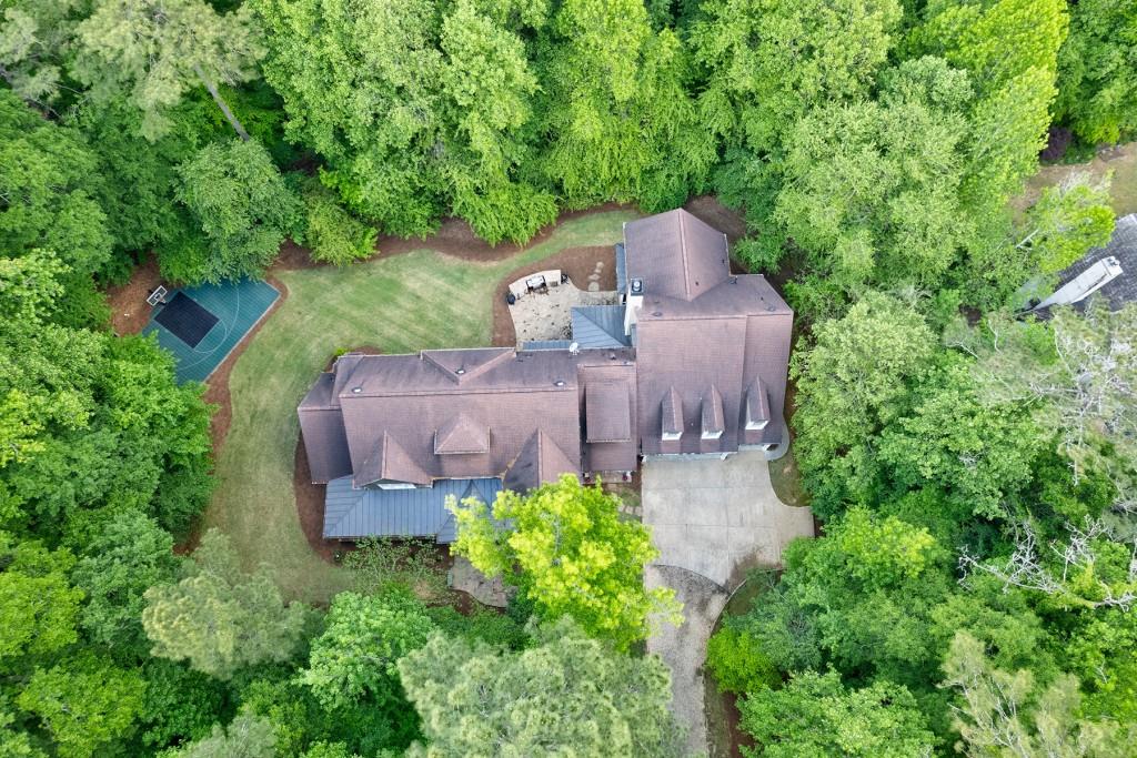 1410 Old Riverside Road Roswell, GA 30076 - Photo 1 of 1 an aerial view of a house with a yard and large trees