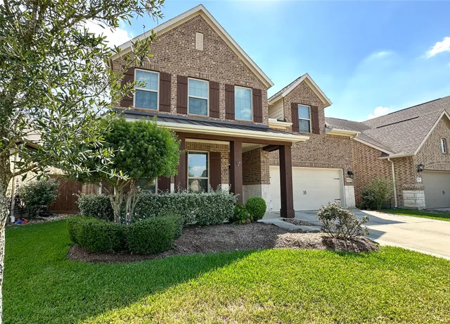 a house view with a garden space