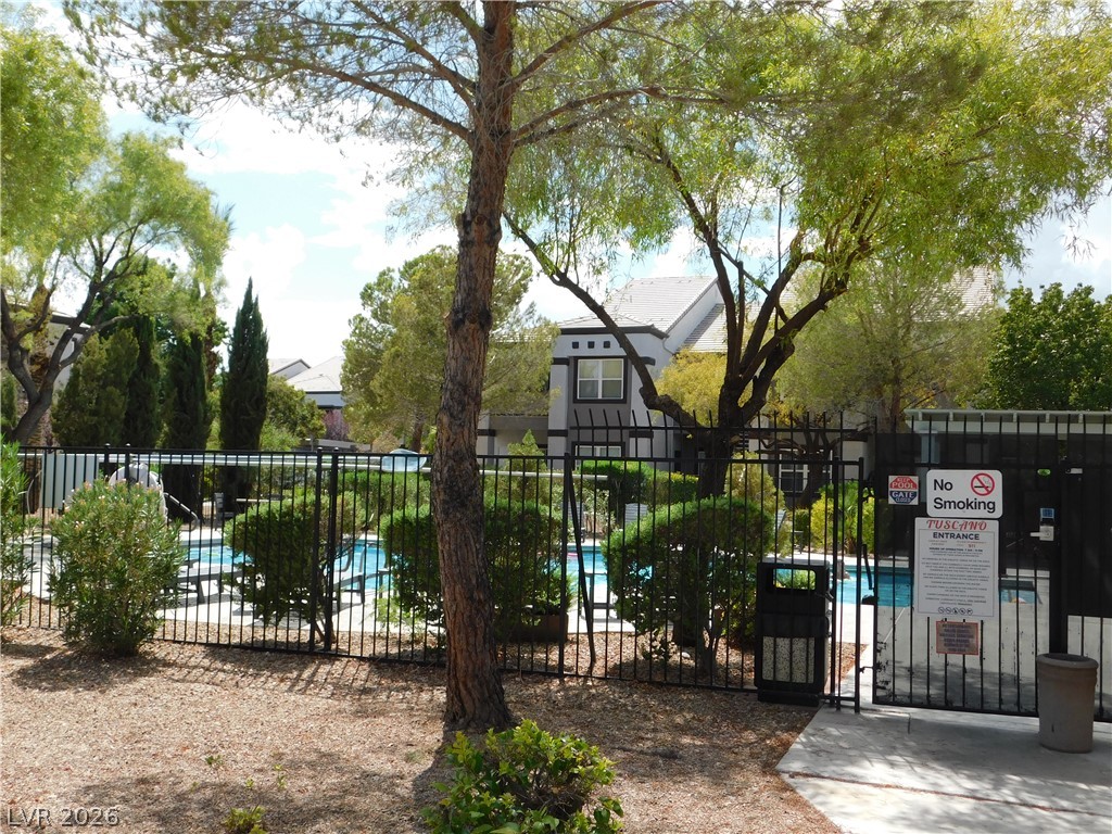 7255 West Sunset Road, Unit 2029 Las Vegas, NV 89113 - Photo 27 of 28 A community pool offers refreshing recreation, enclosed by sturdy fencing and surrounded by well-maintained landscaping.