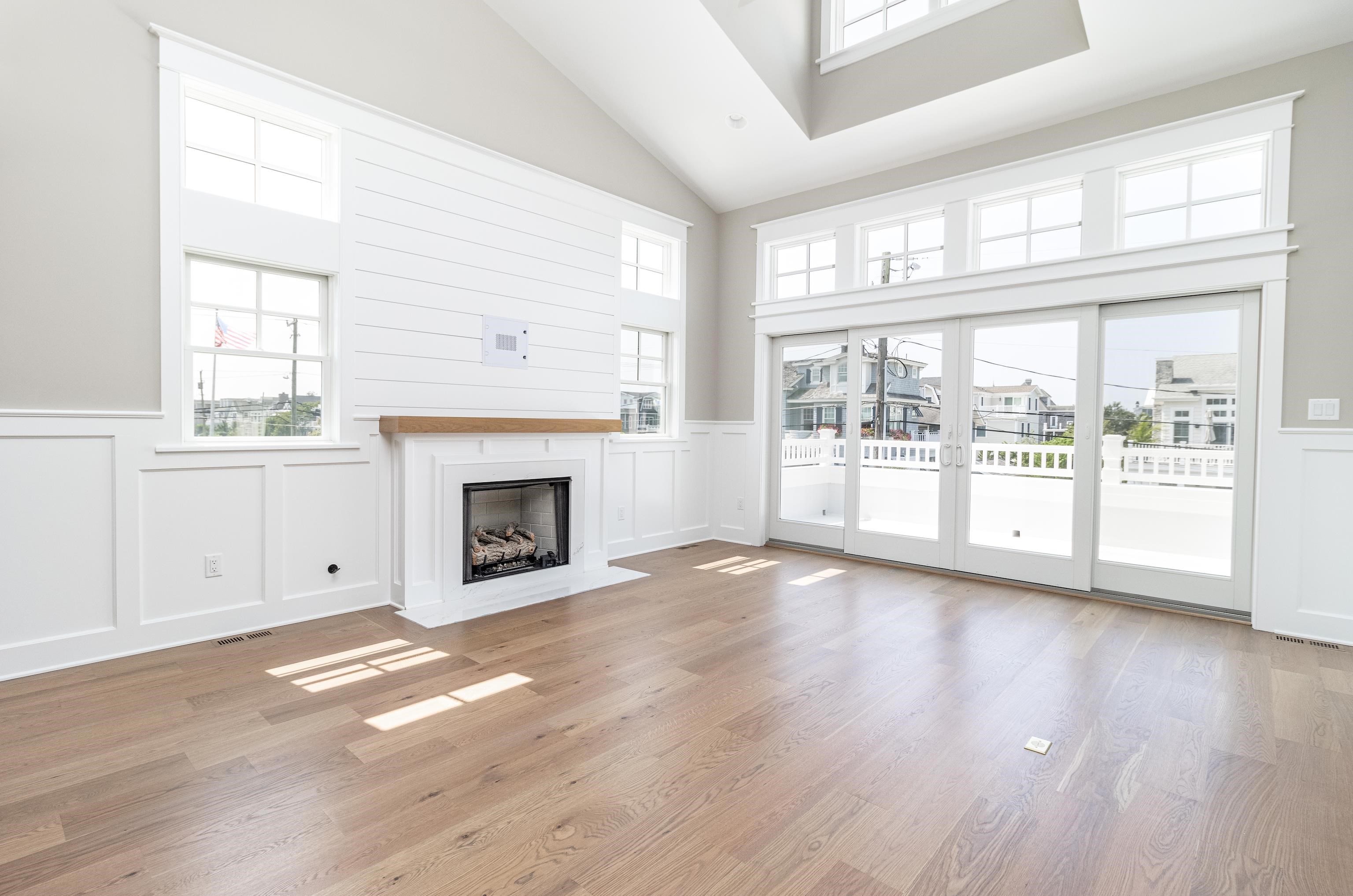 121 32nd Street Avalon, NJ 08202 - Photo 13 of 35 a view of an empty room with wooden floor and a window