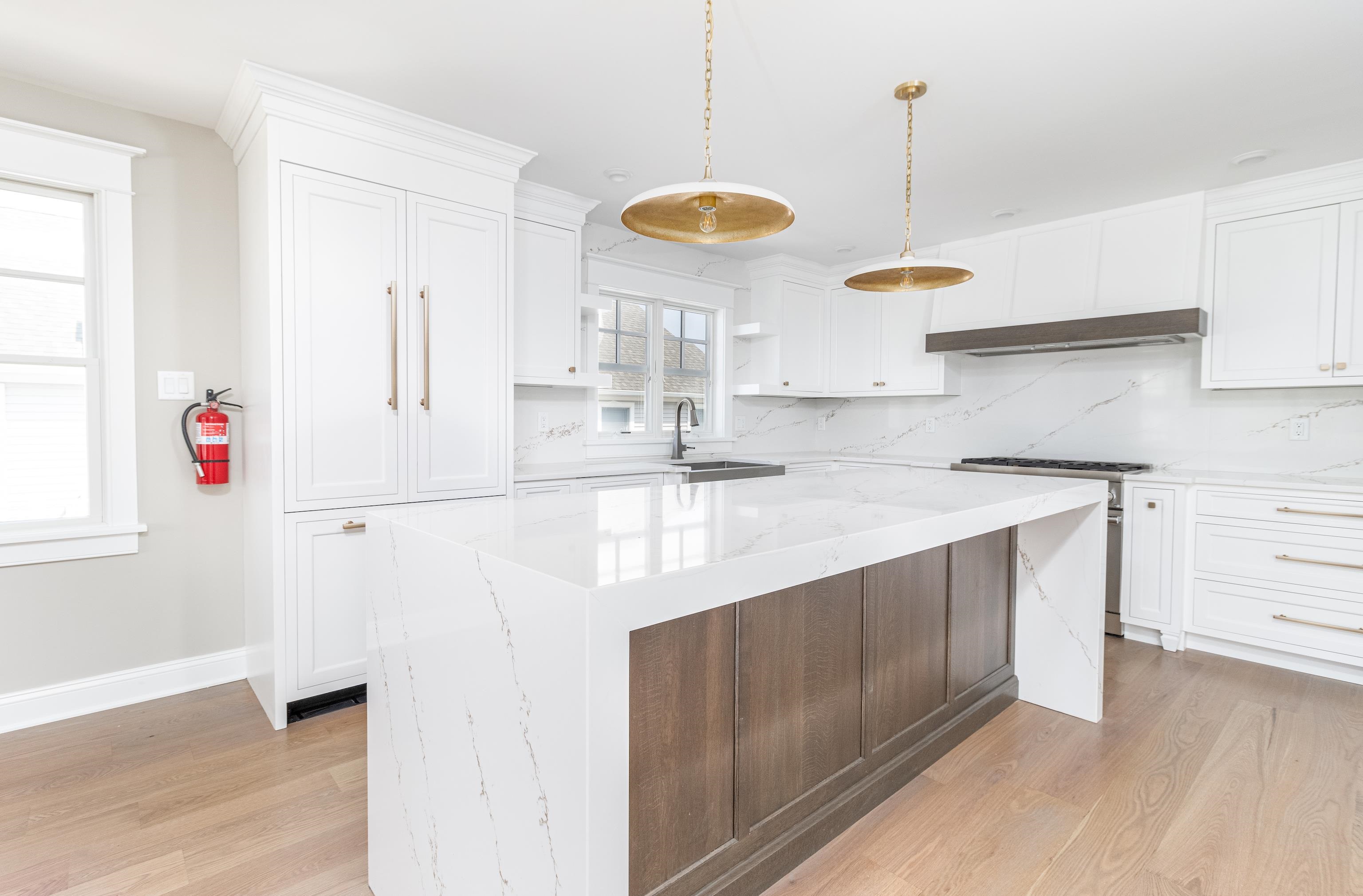 121 32nd Street Avalon, NJ 08202 - Photo 16 of 35 a kitchen with kitchen island granite countertop a sink and a stove