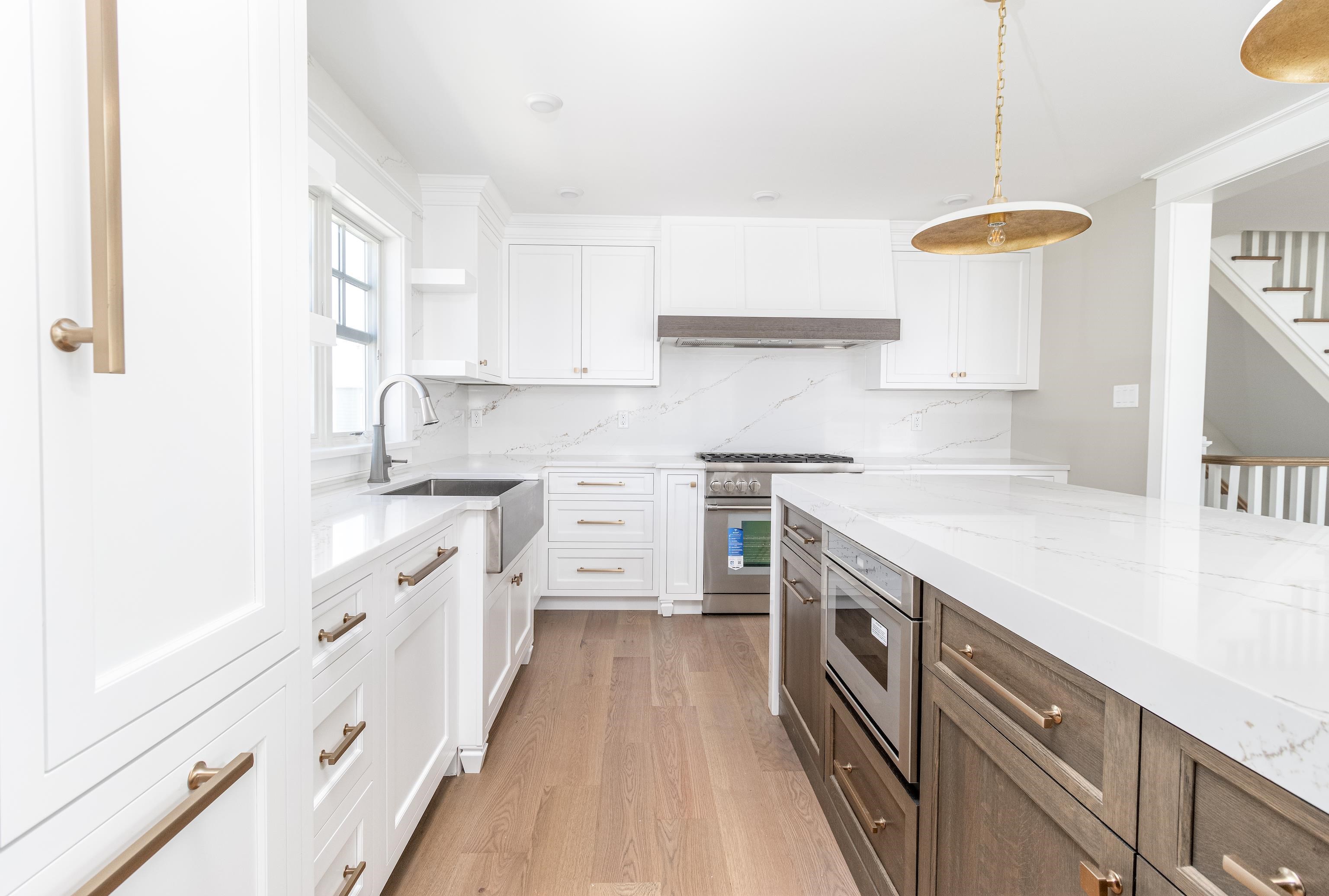 121 32nd Street Avalon, NJ 08202 - Photo 18 of 35 a kitchen with stainless steel appliances granite countertop a stove and a sink
