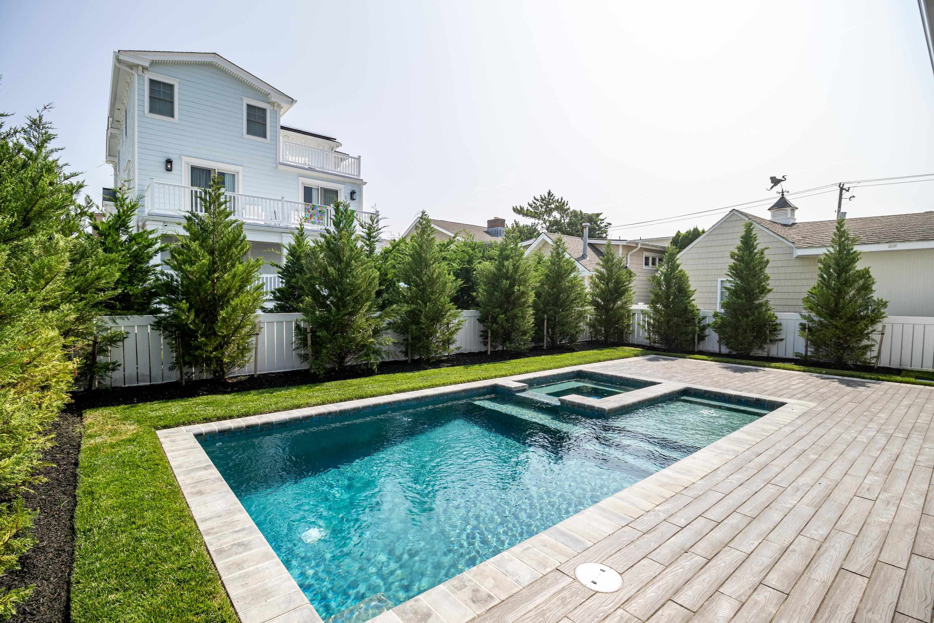 121 32nd Street Avalon, NJ 08202 - Photo 32 of 35 a view of a swimming pool with an outdoor space and seating area