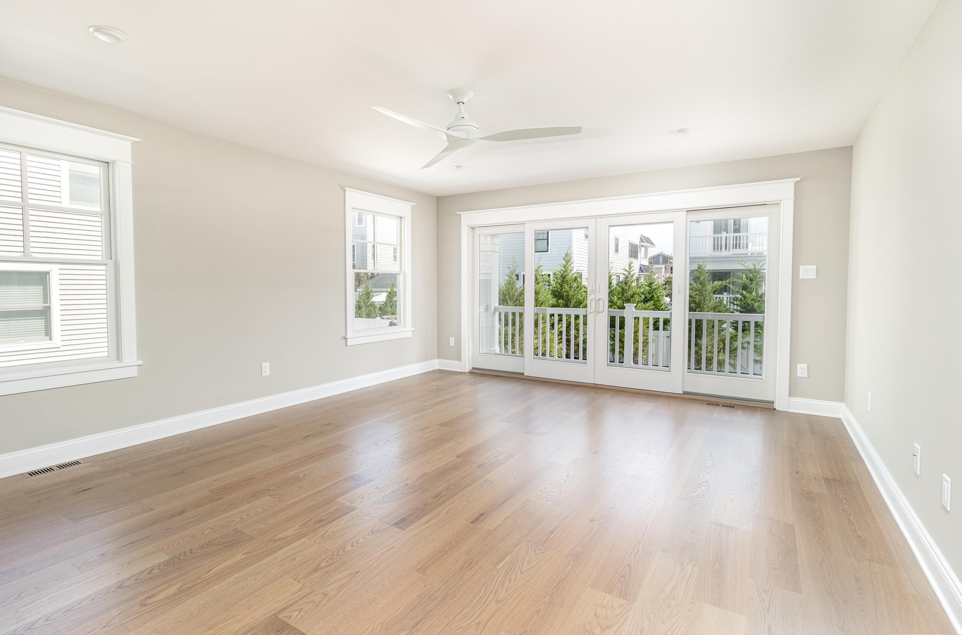 121 32nd Street Avalon, NJ 08202 - Photo 7 of 35 a view of an empty room with wooden floor and a window