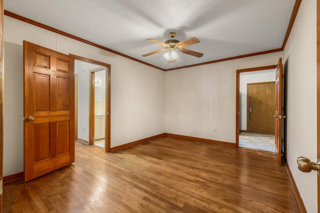 1930 Hollywood Road Northwest Atlanta, GA 30318 - Photo 15 of 19 an empty room with wooden floor hallway and closet area