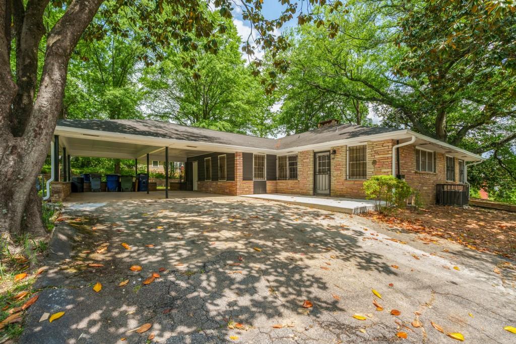 1930 Hollywood Road Northwest Atlanta, GA 30318 - Photo 2 of 19 a view of a house with a yard