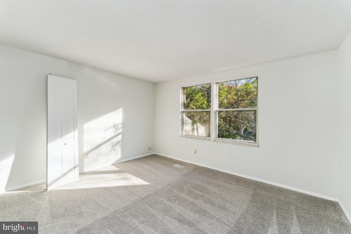 8106 Triple Crown Road Bowie, MD 20715 - Photo 18 of 26 an empty room with windows