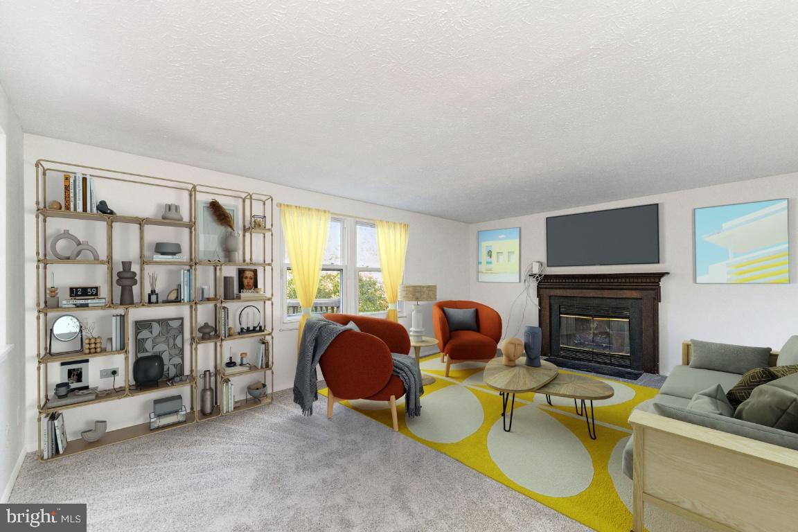 8106 Triple Crown Road Bowie, MD 20715 - Photo 6 of 26 a living room with furniture a fireplace and a flat screen tv