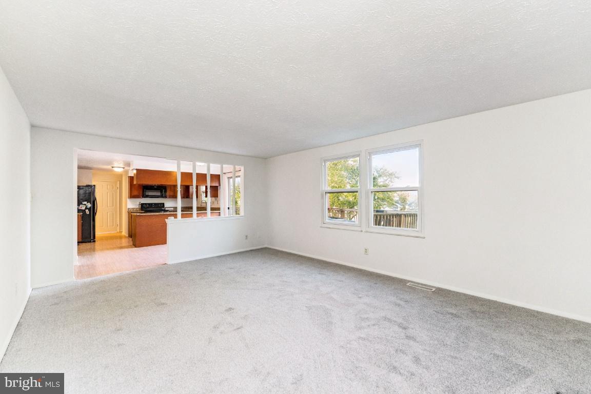 8106 Triple Crown Road Bowie, MD 20715 - Photo 7 of 26 a view of an empty room with a window