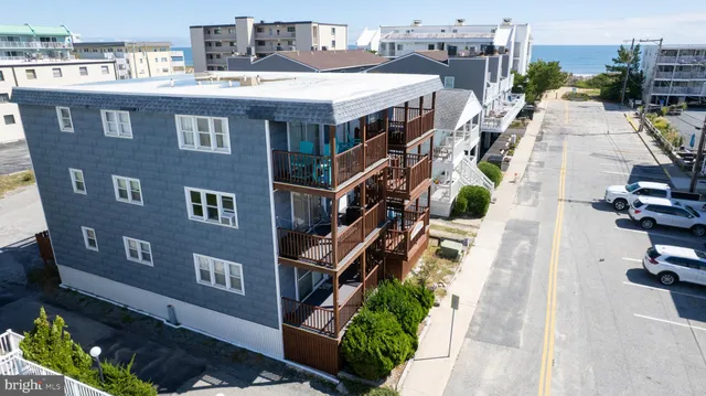 a aerial view of a house with sitting area and furniture