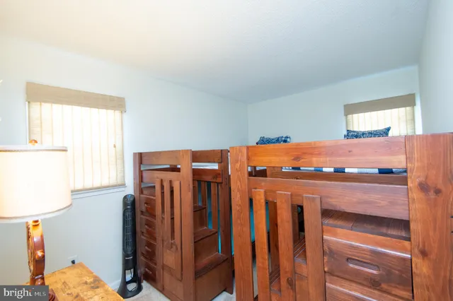 a view of a room with furniture and window